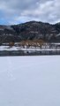 Boat Slides Through Snow Between Lakes