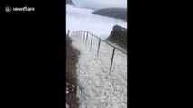 Storm Dennis whips up sea foam on Irish coast