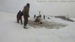 Men Work to Rescue Horses from Frozen Pond