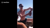 Man challenges himself to drink a beers while riding a go-fast boat