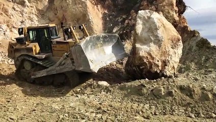 Cat D8T Bulldozer Pushing Huge Stone
