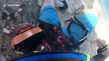 Paraglider comes inches from falling off '1,000ft' cliff face in failed launch