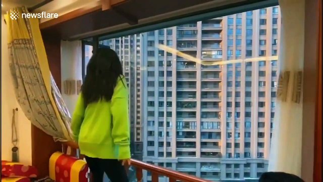 Quarantined Chinese citizens take part in dance battle on their balconies during COVID-19 outbreak