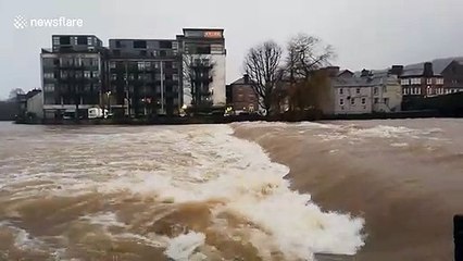 Localised flooding causes river to swell in Cumbria, UK