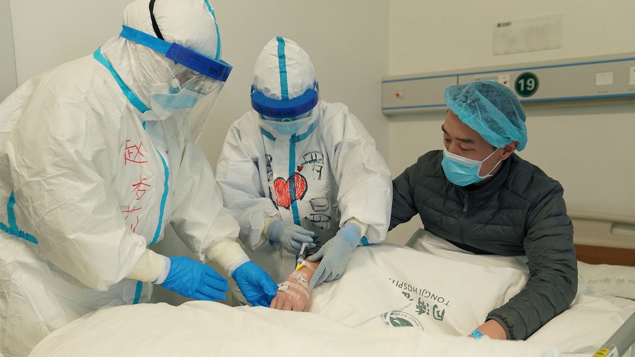 China sees sharp fall in new coronavirus cases as Beijing revises diagnosis protocol