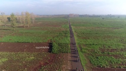 Aerial View - Riding bike in the forest part 1