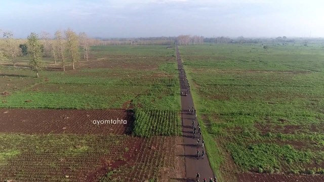 Aerial View - Riding bike in the forest part 1