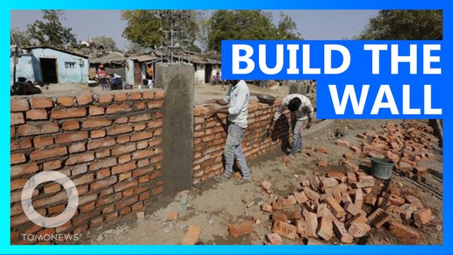 India builds wall to hide poor people during Trump visit