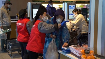 Chinese supermarkets battle to stay open during the coronavirus epidemic