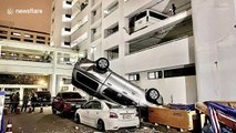 Thai driver shunts pickup truck off multi-storey car park before fleeing scene