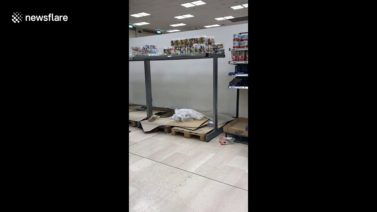 Empty shelves in Milan supermarket as coronavirus puts parts of the region on lockdown