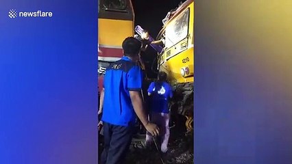 Emergency workers seen rescuing man after train crash in Thailand