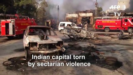 Police block roads in New Delhi as sectarian violence kills 13