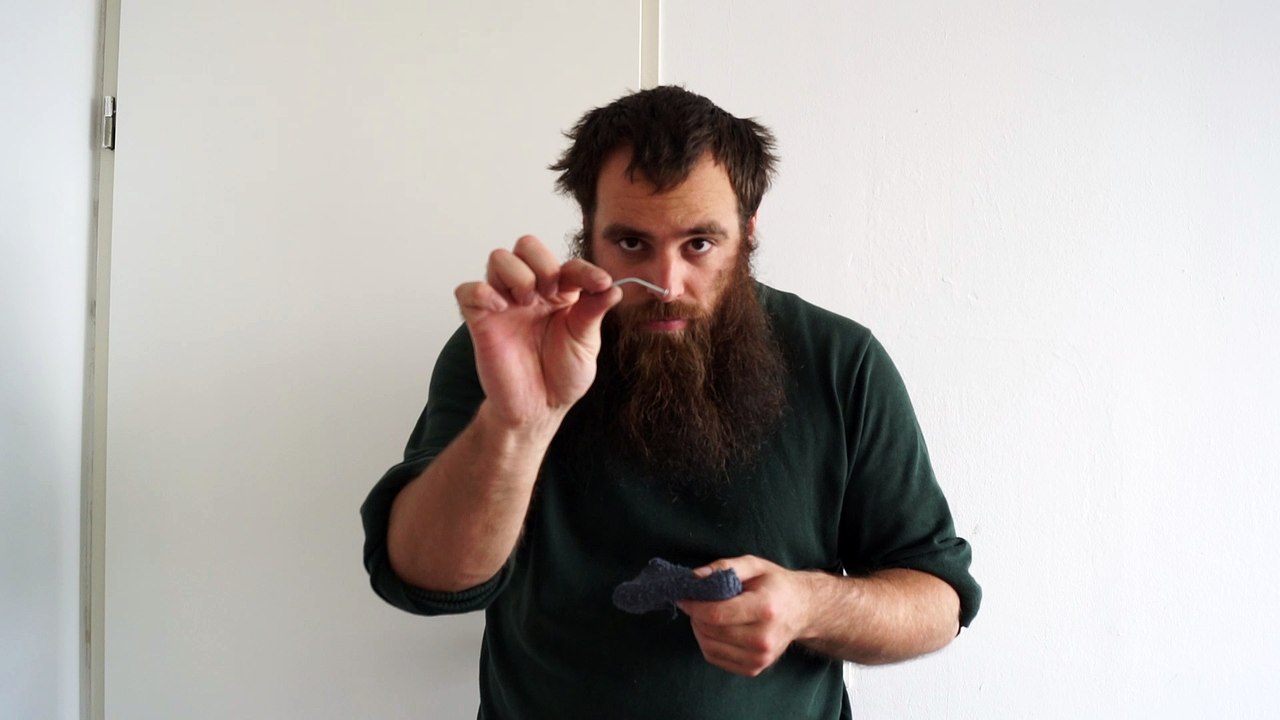 Old time strongman bending a 2,7 mm x 60 mm nail