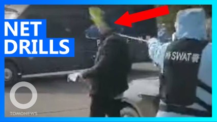 China SWAT team practices using nets to nab COVID-19 victim