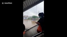 Widespread flooding across Indonesia's Jakarta forces shops to temporarily close