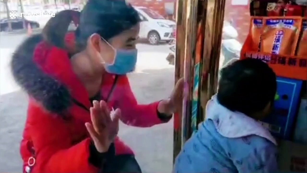 Coronavirus nurse kisses son through glass window after not seeing him for 26 days