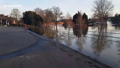 Download Video: River Severn breaks its banks in the UK flooding children's playground and huge car park