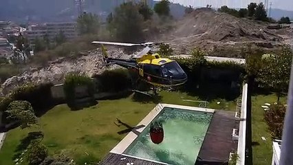 Amazing helicopter pilot taking water from swimming pool Funny Video