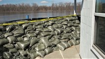 Why do people use sandbags before a flood?