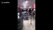 Two shoppers fight near the tills of supermarket in quarantined Italian town