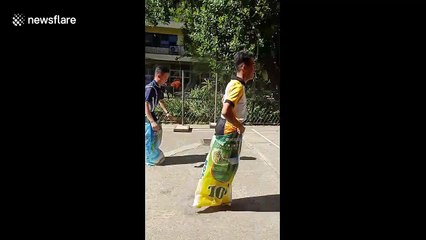 Hilarious moment Filipino student uses cartwheel hack to win sack race at school sports day