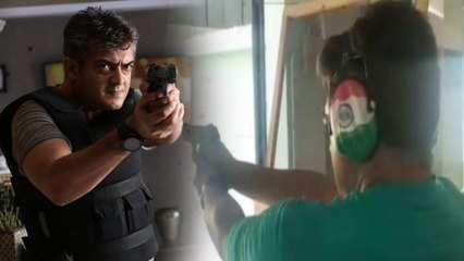 துப்பாக்கியுடன் நிற்கும் நடிகர் அஜித்