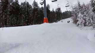 Skier Jumps A Ramp And Falls Out Of His Skis