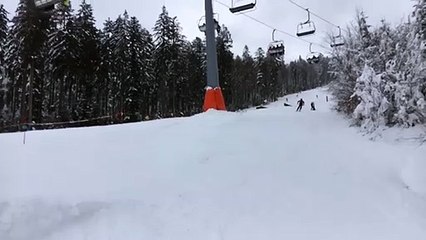 Skier Jumps A Ramp And Falls Out Of His Skis