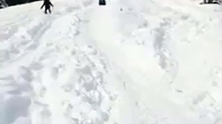 Woman Slides Down A Hill Of Snow