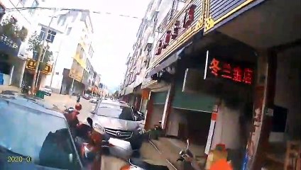 Truck plunges into parked vehicles after trying to avoid boy crossing road in China