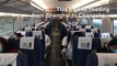 Passengers take virus precautions as train passes through Wuhan