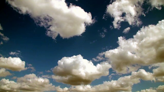 Stock Video - Clouds timelapse UHD with fluffy clouds flying by - Stock Video Footage