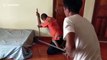 King cobra coils around snake wrangler's body after being caught under pensioner's bed in Thailand