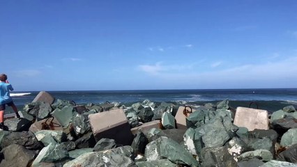 Kid Gets Swept off His Feet by Ocean