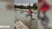 Man Performs Amazing Feat Of Hopping Bike Along Pedestals In A Pool And Not Falling In