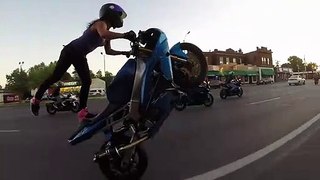 Crazy girl does motorcycle stunts