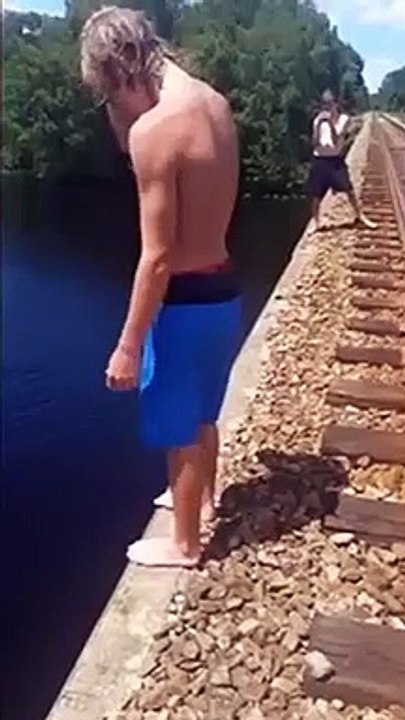 Guy Does A Back Flip Into The Water And Lands On His Stomach