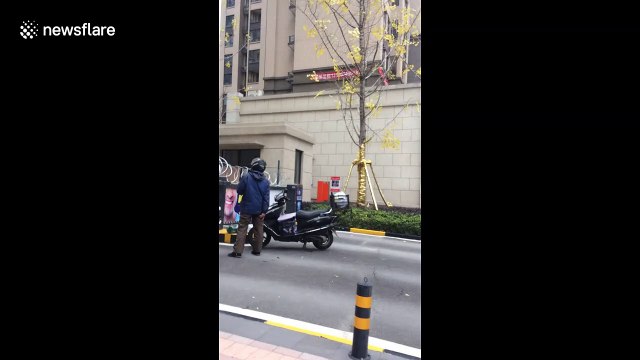 UK coronavirus survivor documents barbed wire food collection points in Wuhan as residents remain in lockdown