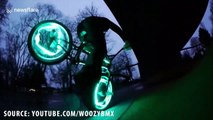 Parkour and BMX athletes perform impressive stunts with LED lights in tyres