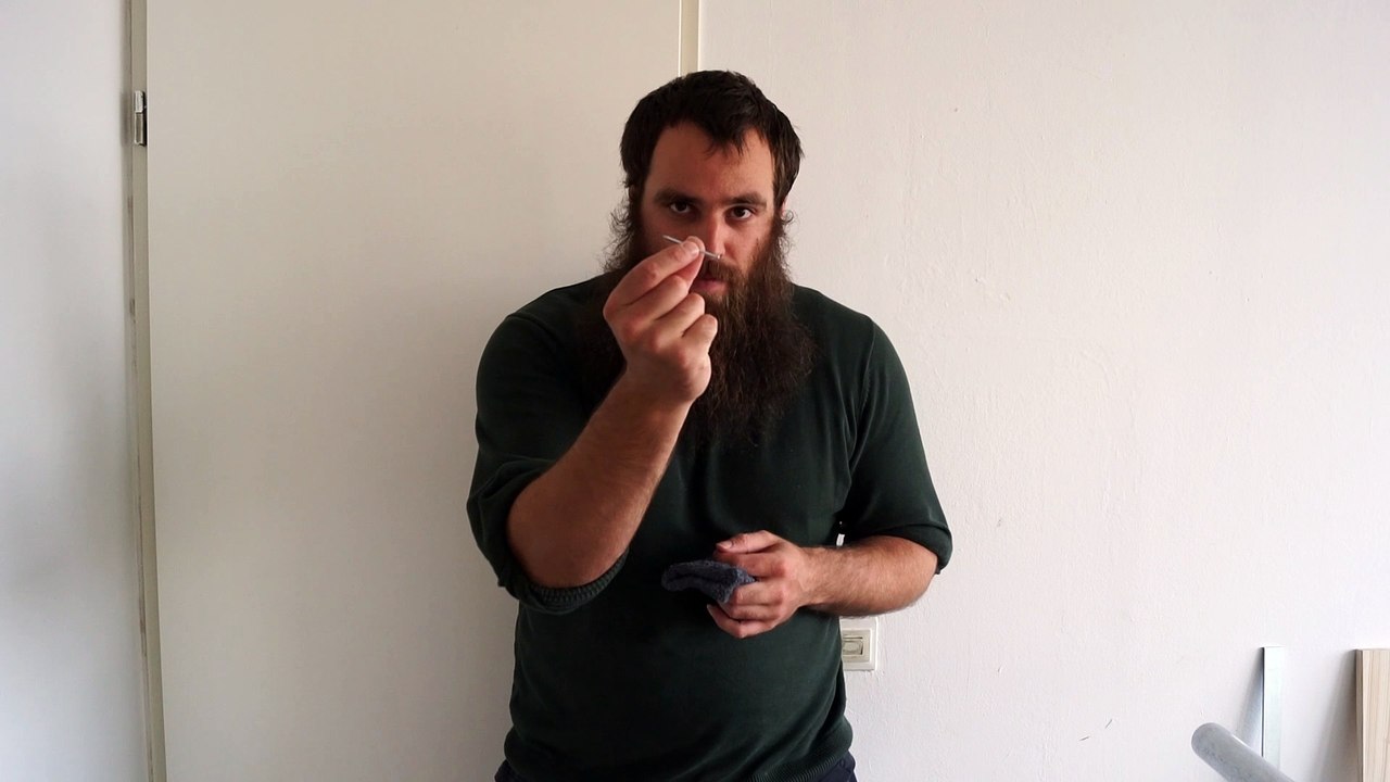 Old time strongman bending a 2,7 mm x 50 mm nail