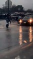 Boy Carries Fellow Students Across Flooded Street