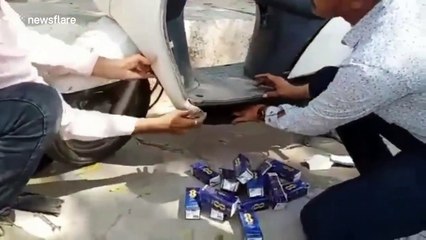 Smuggler caught hiding 250 cartons of liquor inside scooter in Gujarat, western India