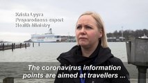 Coronavirus information posters set up at Helsinki harbour, Europe's busiest passenger port