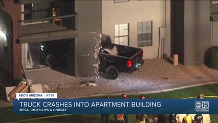 Truck crashes into apartment building