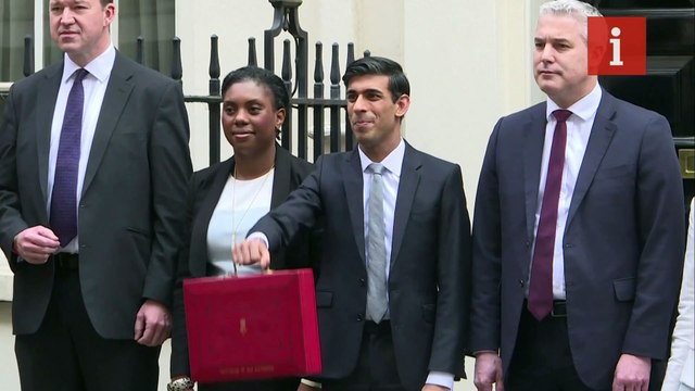 Chancellor Rishi Sunak presents red box before delivering his first budget statement