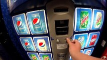 Getting a  pepsi out of a vending machine at Walmart