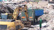 Locals in Nairobi, including children, face pollution while scavenging at hazardous landfill