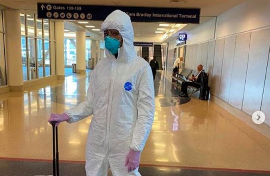Naomi Campbell wears hazmat suit through LAX airport