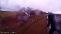 Terrifying footage shows speeding car narrowly avoid cyclist and swerve into tree off UK motorway